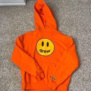 Drew House Vibrant Orange Hoodie with Yellow Smiley